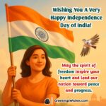 Happy Independence Day Of India image featuring a person proudly holding the Indian flag near a monument under a warm daylight sky symbolizing freedom unity and progress.